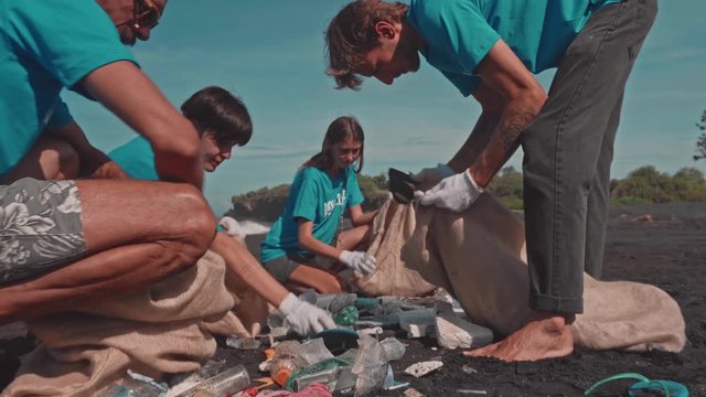 People Volunteers Sorting Garbage. Special Environmentally Friendly Housewifely Campaign for Separate Waste Collection and Further Processing. Beach Tidying Up Rubbish, Charity, People, and Ecology
