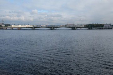 Neva river and Trinity bridge with cloudy sky background.