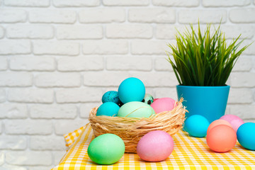 Easter decorative nest with colored eggs close up