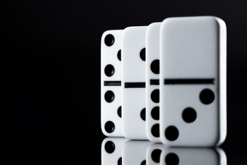 Close up of Domino pieces on black background