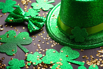 Happy Saint Patrick's Day greeting card with traditional symbols, shamrock, green attire. Green...