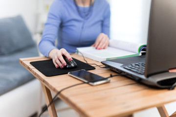 Woman using laptop - freelance job, working on a computer.