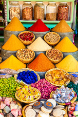 Herbs and spices sold in a shop in the souks of Marrakesh, Morocco - 324807974