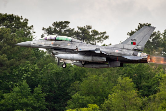 Portuguese Air Force F-16 fighter jet taking off with afterburner from Mont-de-Marsan airbase during the NATO Tigermeet. MONT-DE-MARSAN, FRANCE - MAY 17, 2019.