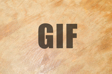 Gif word written on wooden background