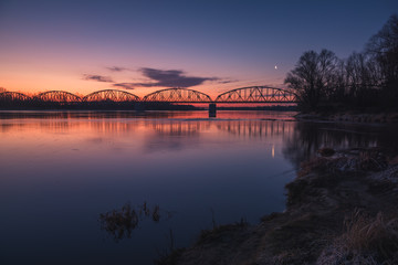 Trailway bridge over the Vistula river at night in Gora Kalwaria, Poland