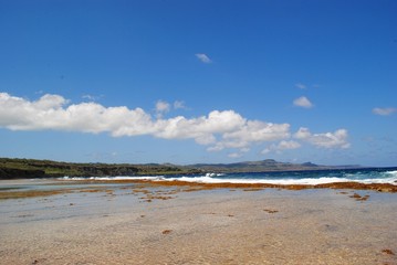Wide shot of Tank Beach at low tide, Saipan, Northern Mariana Islands