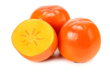 fresh ripe persimmons with slices isolated on white background