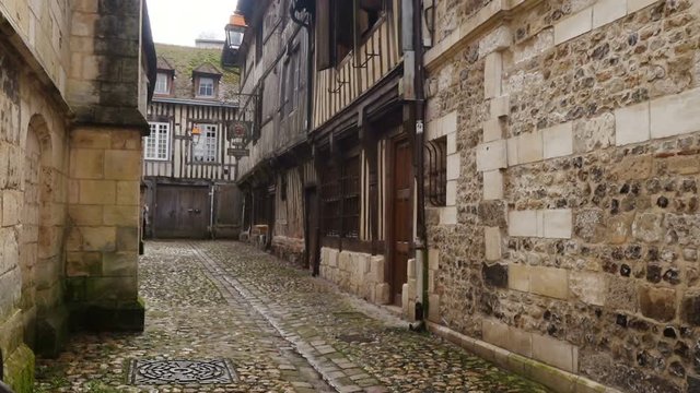HONFLEUR, FRANCE - APRIL 08, 2018: view of empty beautiful street with old traditional houses at the center of Honfleur, Normandy, France