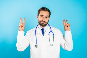 Doctor man with beard showing with hands and two fingers like quotes gesture, bend fingers isolated...