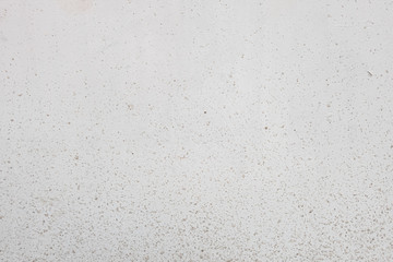 abstract background of an old white wall in drops of dirt