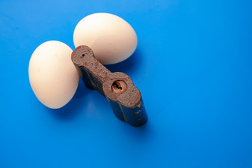 two eggs on lock,blue background,iron Oran in the form of a padlock