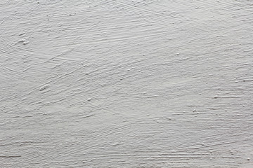 White painted cement wall texture and gray color. Cement plastered with car marks.
