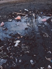  Puddle with quarrel on the street. Environmental pollution