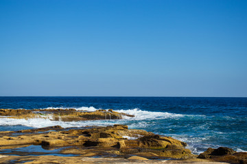 salt rocks coastline and beautiful blue sea scenery