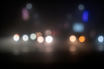 Blurred light of car headlamps headlights, soft focus.  Multicolor bokeh,blur focus.