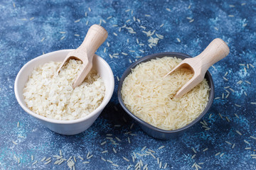 Rice flakes,rice noodles,rice bread and rice on dark background,top view