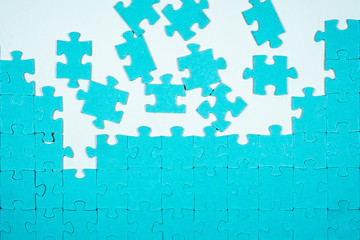Undone puzzle jigsaw. Blue puzzle on white background.