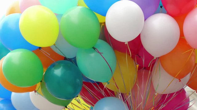 Many colorful balloons flying in the air. Celebration and birthday concept.