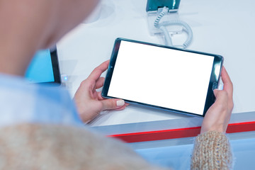 Mock up, copyspace, white screen, template, technology concept. Woman customer testing new model of tablet with blank white display at electronic shop, store, trade show, exhibition: mockup image