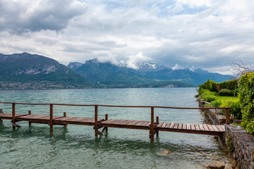 Annecy lake in French Alps in cloudy day. Beautiful landscape.