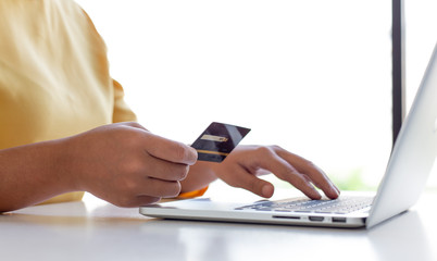 Women use laptop register via credit cards to make online purchases, Online shopping or Internet technology concept.