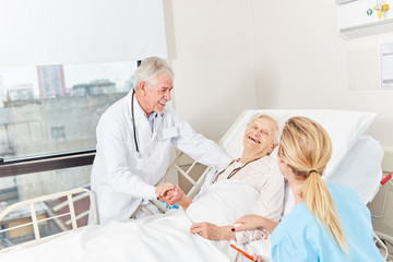 Doctor and nurse at the bedside
