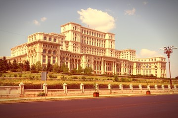 Fototapeta na wymiar Bucharest Parliament. Vintage style filtered colors.