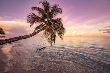 Wood swing beautiful sunset on the sea beach. Luxury sunset landscape, tropical nature view. Lounge swing over water, paradise, dream carefree concept