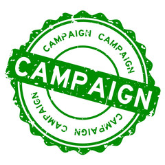 Grunge green campaign word round rubber seal stamp on white background