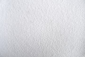 Texture of wet snow adhering to the iron parts of a car.