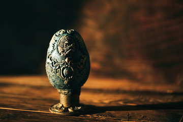 vinage Easter egg decorated with papier-mache hand made, beautiful decorations on egg at stand,...