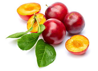 Fresh plum in cut with green leaf. Fruity still life. Healthy food. Isolated on white background.