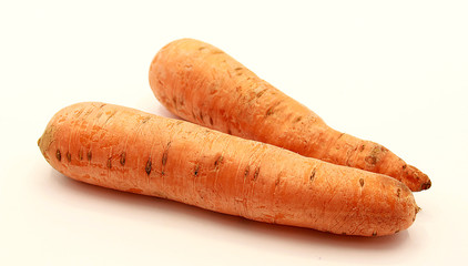 Orange washed carrots isolated on white background