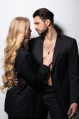 attractive woman and handsome man looking at each other on white