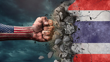 Fist breaking rock. USA destroying Thailand