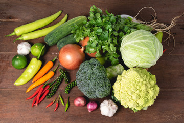 Various kinds of fresh vegetable on rustic wood background with copy space for text