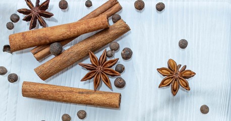 Cooking background, Star anise with cinnamon rolls and sweet peppers