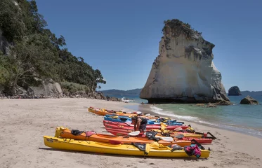 Tuinposter Coromandel New Zealand Cathedral Cove Hahei. Coast and beach. Canoe. Kayak at the beach. © A