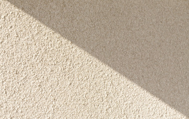 Background of light concrete wall with shaddow.White classic texture for designer background. Rough lighted surface. Concrete wall with plaster. light concrete. concrete coat