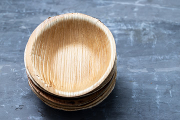 bio-degradable eco-freandly small dishes on ceramic background