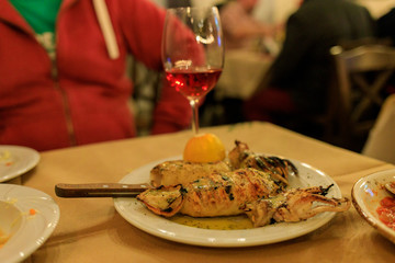 grilled squid on a plate with lemon