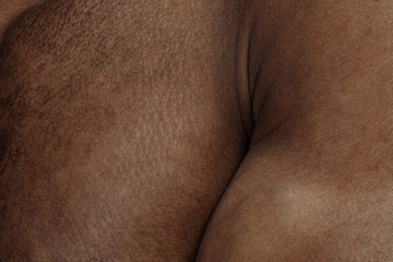 Chest. Detailed texture of human skin. Close up shot of young african-american male body. Skincare, bodycare, healthcare, hygiene and medicine concept. Looks beauty and well-kept. Dermatology.