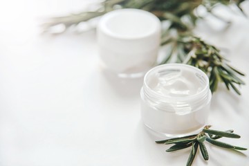 Fototapeta na wymiar Herbal dermatology, hygienic cream skincare product in glass jar on white background