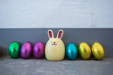 Easter bunnie with colourful chocolate eggs