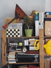 Boxes with old things, with parts for filming, accessories on shelves for storage. Household...