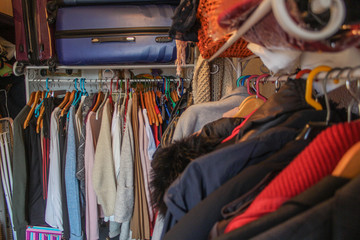 Chaotic wardrobe full of clothes 2 view