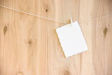 white sheet on clothespins hang on thread