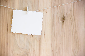 white sheet on clothespins hang on thread