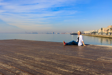 girl on the promenade in a white shirt